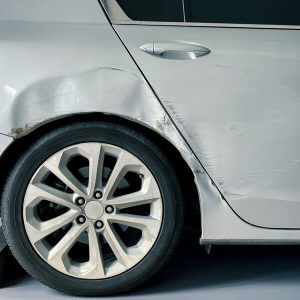 Image showing a car’s aluminum body panel, with guidance for proper care and maintenance.