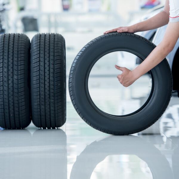 A guide to tire care, with new tires being inspected.